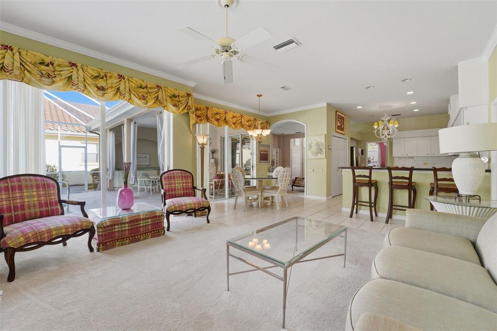 507 Cheval Drive Venice, FL 34292 - Photo 22 of 43 a living room with furniture and a chandelier