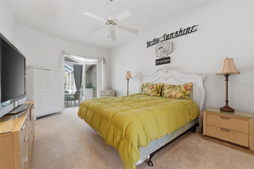 507 Cheval Drive Venice, FL 34292 - Photo 23 of 43 a bedroom with a bed and a flat screen tv