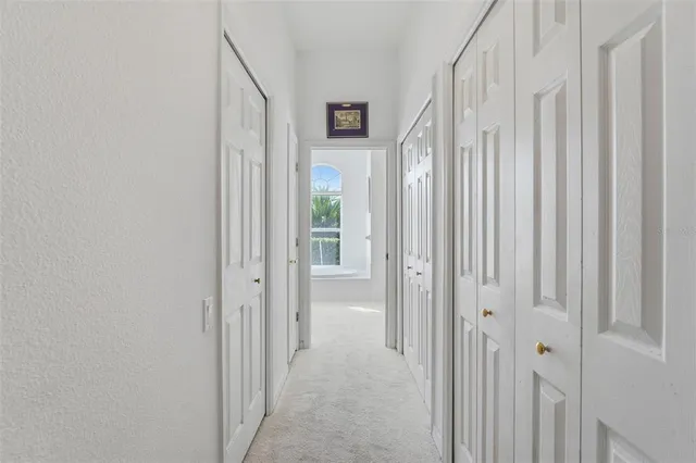 a view of a bedroom from a hallway