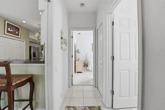 a view of a hallway with wooden shelves