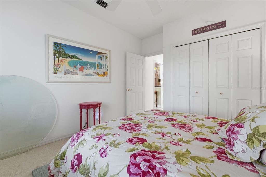 507 Cheval Drive Venice, FL 34292 - Photo 33 of 43 a bedroom with a bed and a painting on the wall
