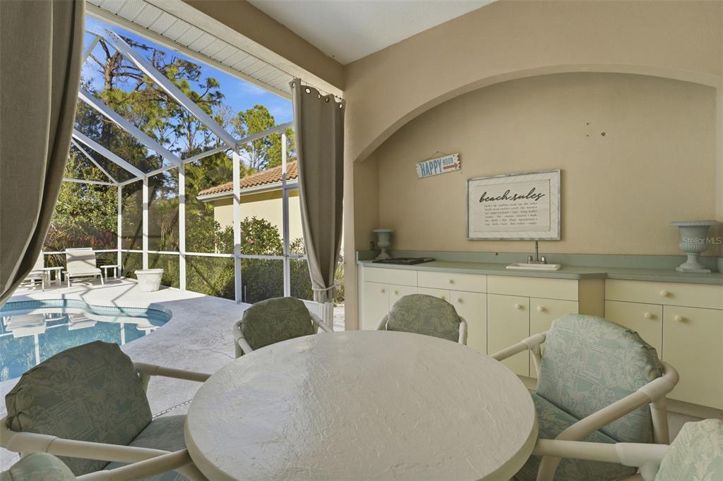 507 Cheval Drive Venice, FL 34292 - Photo 38 of 43 a living room with furniture and a large window