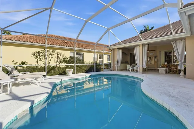a view of a patio with swimming pool table and chairs