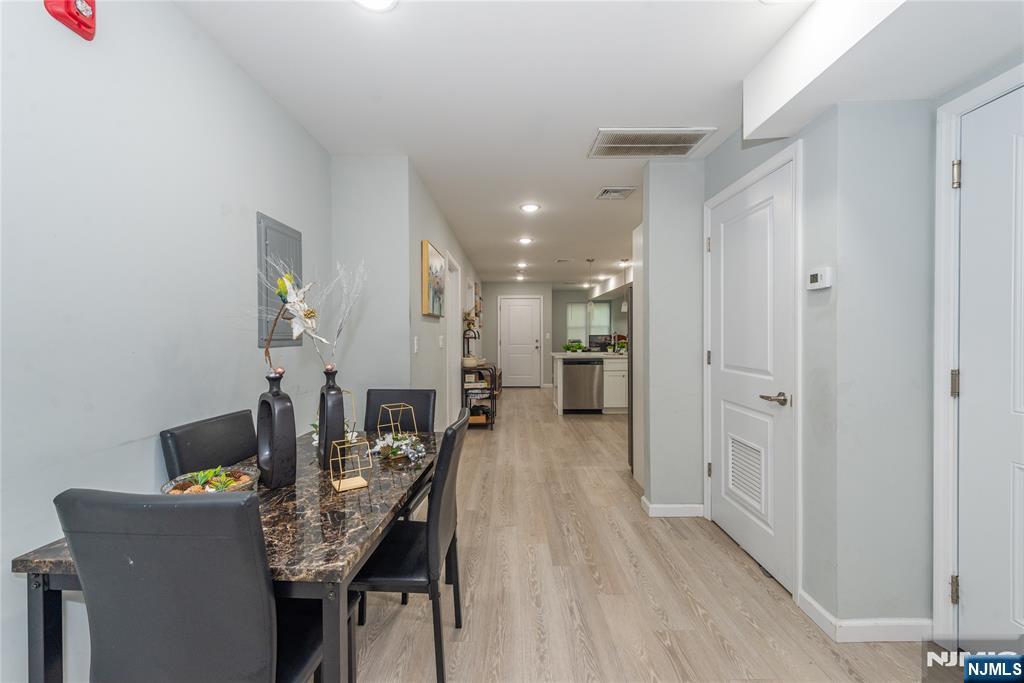 59 Mercer Street Paterson, NJ 07524 - Photo 11 of 15 a dining room with furniture and wooden floor
