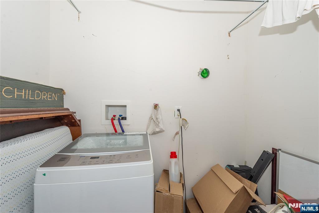 59 Mercer Street Paterson, NJ 07524 - Photo 15 of 15 a utility room with dryer and washer