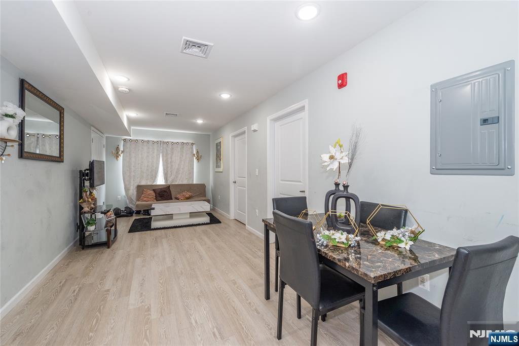 59 Mercer Street Paterson, NJ 07524 - Photo 9 of 15 a living room with furniture and wooden floor