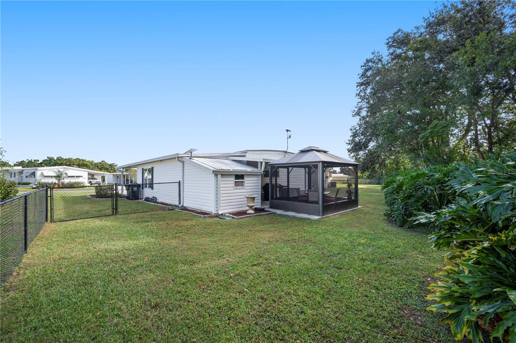 1610 Reynolds Road, Unit 187 Lakeland, FL 33801 - Photo 14 of 20 a view of a house with a yard and sitting area