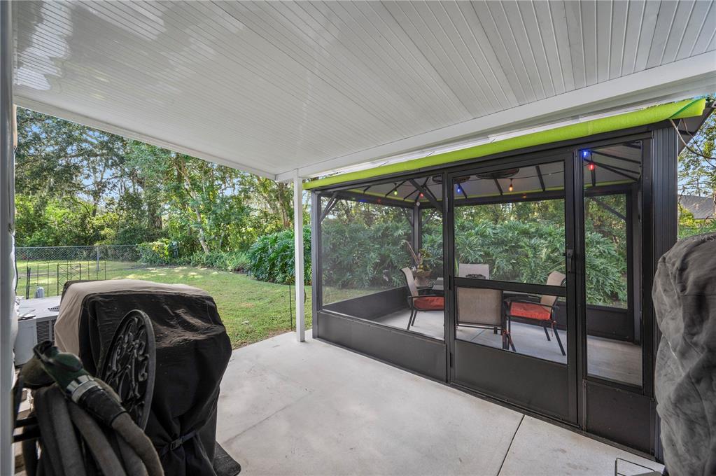1610 Reynolds Road, Unit 187 Lakeland, FL 33801 - Photo 15 of 20 a living room filled with furniture and a floor to ceiling window