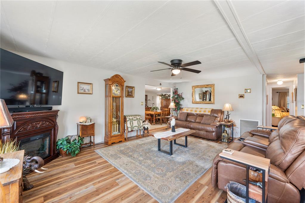 1610 Reynolds Road, Unit 187 Lakeland, FL 33801 - Photo 6 of 20 a living room with furniture and a flat screen tv