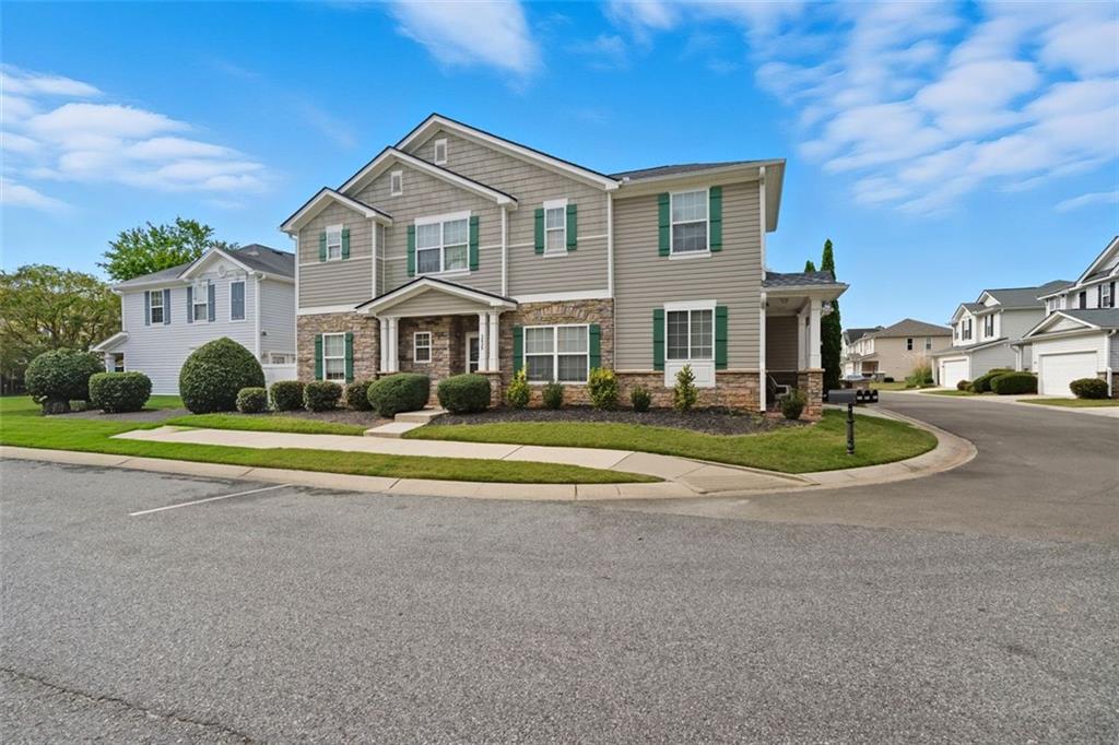 3635 Roseman Landing Cumming, GA 30040 - Photo 1 of 31 a front view of a house with a yard