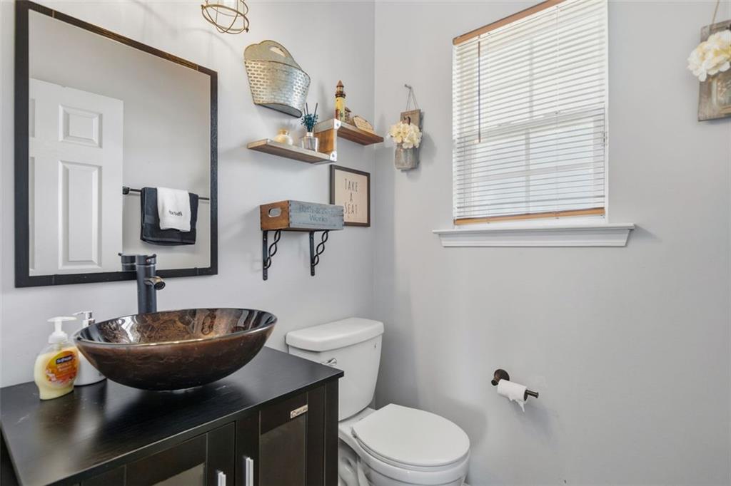 3635 Roseman Landing Cumming, GA 30040 - Photo 11 of 31 a bathroom with a sink and a mirror