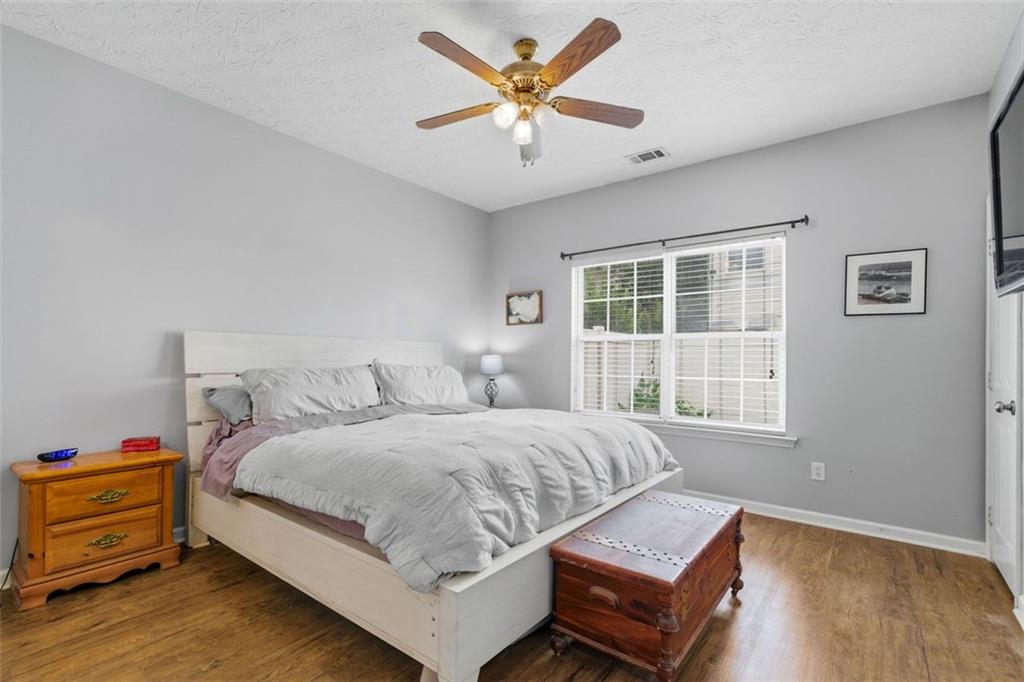 3635 Roseman Landing Cumming, GA 30040 - Photo 12 of 31 a bedroom with a bed and window