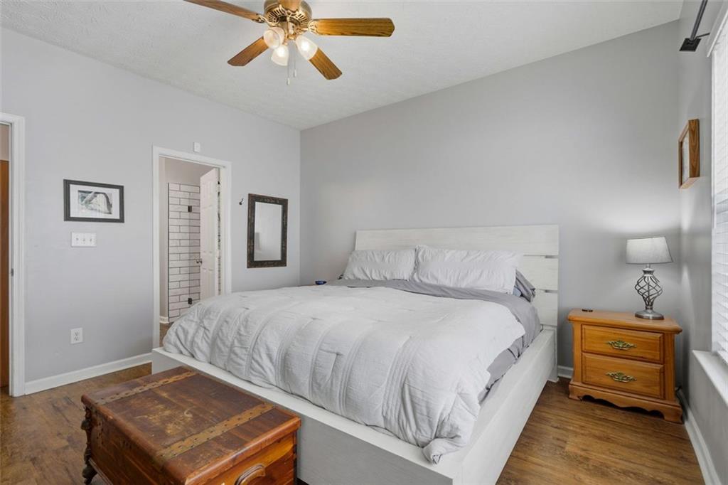 3635 Roseman Landing Cumming, GA 30040 - Photo 13 of 31 a bedroom with a bed and a chandelier