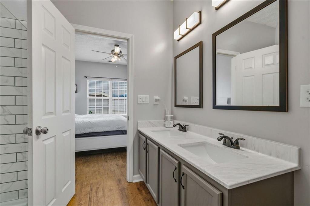 3635 Roseman Landing Cumming, GA 30040 - Photo 14 of 31 a en suite bathroom with a sink and a mirror