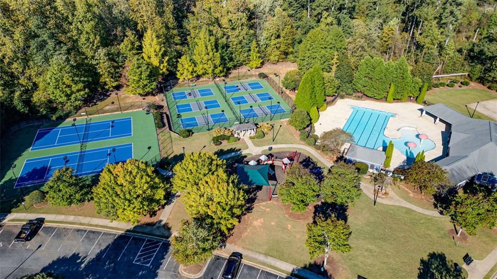3635 Roseman Landing Cumming, GA 30040 - Photo 25 of 31 a view of a house with a lot of flower plants