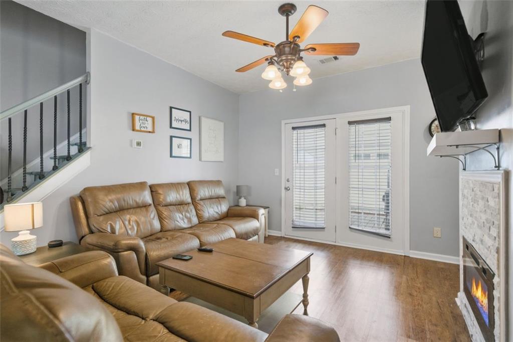 3635 Roseman Landing Cumming, GA 30040 - Photo 10 of 31 a living room with furniture and a flat screen tv