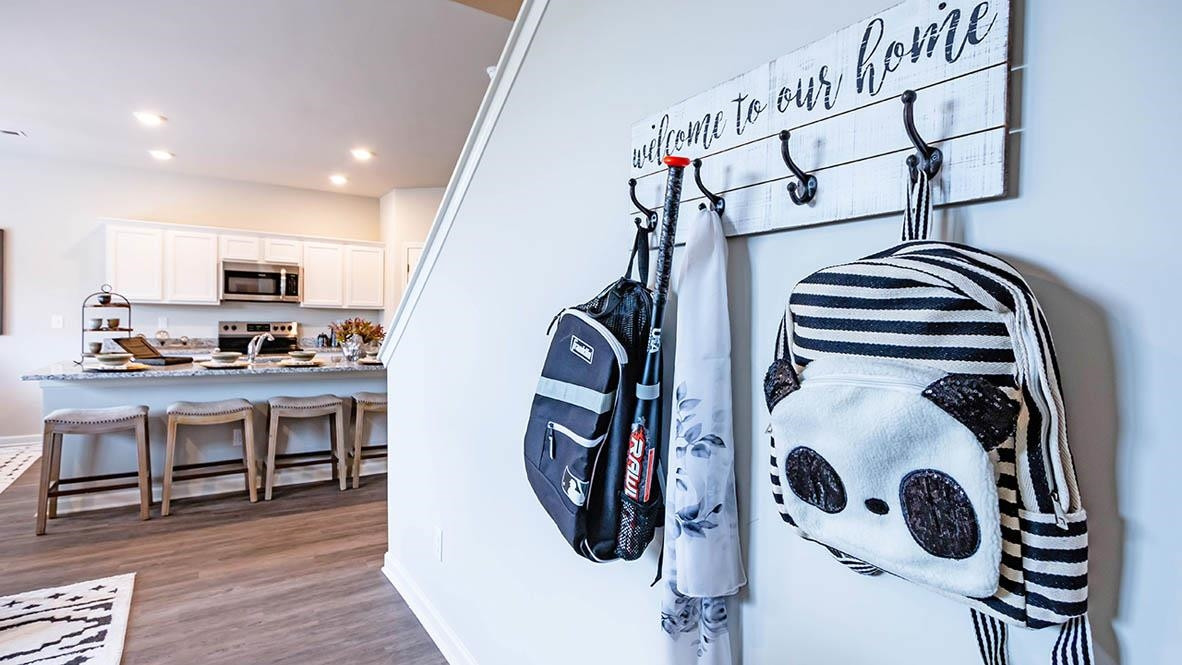 1734 Carter Daniel Drive Graham, NC 27253 - Photo 14 of 23 a walk in closet with wooden floor and windows