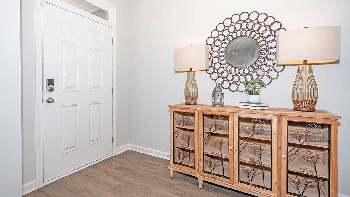 1734 Carter Daniel Drive Graham, NC 27253 - Photo 3 of 23 an empty room with wooden floor and white walls