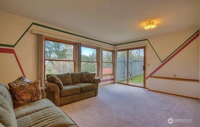 9502 South 200th Street Kent, WA 98031 - Photo 12 of 21 a living room with furniture and a large window
