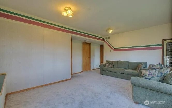 9502 South 200th Street Kent, WA 98031 - Photo 13 of 21 a living room with furniture and a ceiling fan