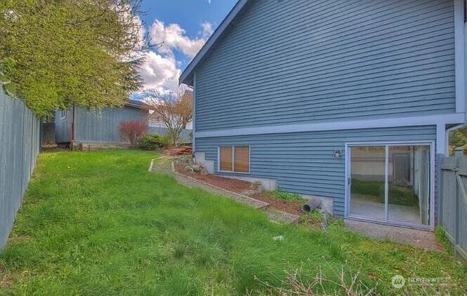 9502 South 200th Street Kent, WA 98031 - Photo 20 of 21 a backyard of a house with table and chairs