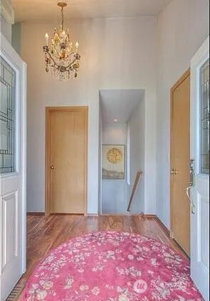 9502 South 200th Street Kent, WA 98031 - Photo 2 of 21 a view of a bedroom with wooden floor and hallway