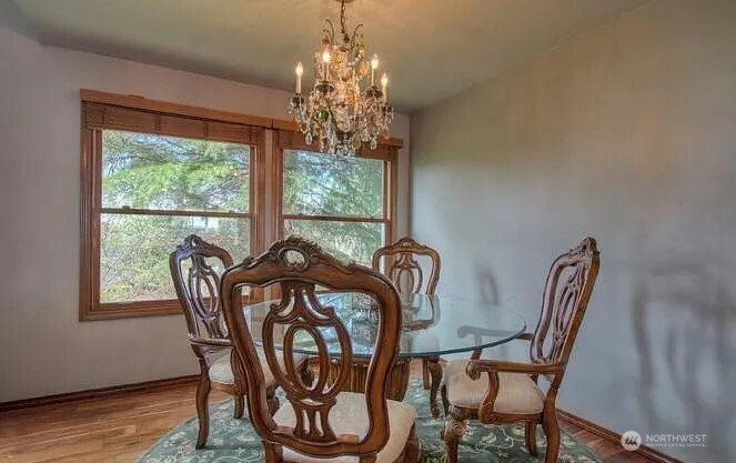 9502 South 200th Street Kent, WA 98031 - Photo 8 of 21 a view of a dining room with furniture window and outside view