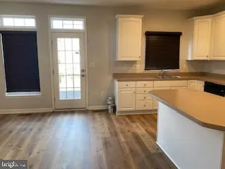 a kitchen with stainless steel appliances a refrigerator stove microwave and cabinets