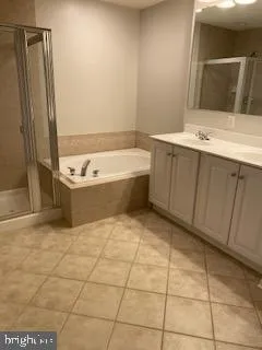 a view of a house with a wooden fence