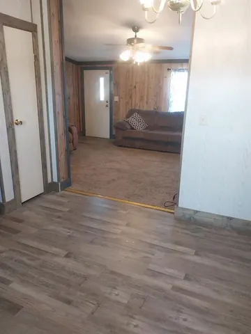 a view of a livingroom with furniture and a window