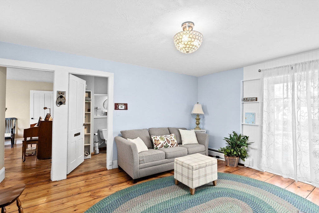 85 Summit Street Halifax, MA 02338 - Photo 16 of 42 a living room with furniture and wooden floor