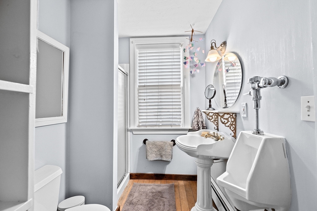 85 Summit Street Halifax, MA 02338 - Photo 17 of 42 a bathroom with a sink mirror and toilet