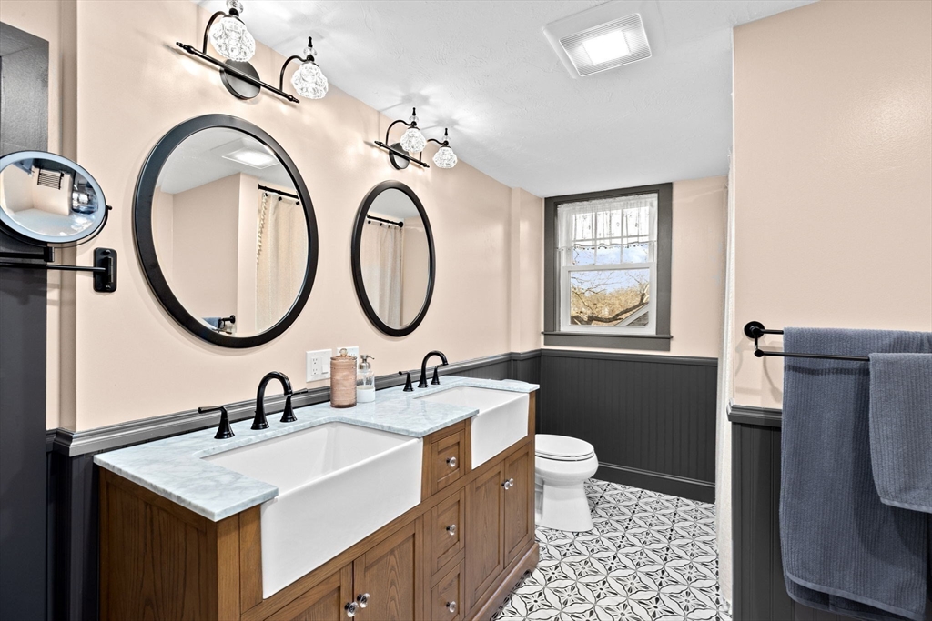 85 Summit Street Halifax, MA 02338 - Photo 23 of 42 a bathroom with a sink a toilet and a mirror