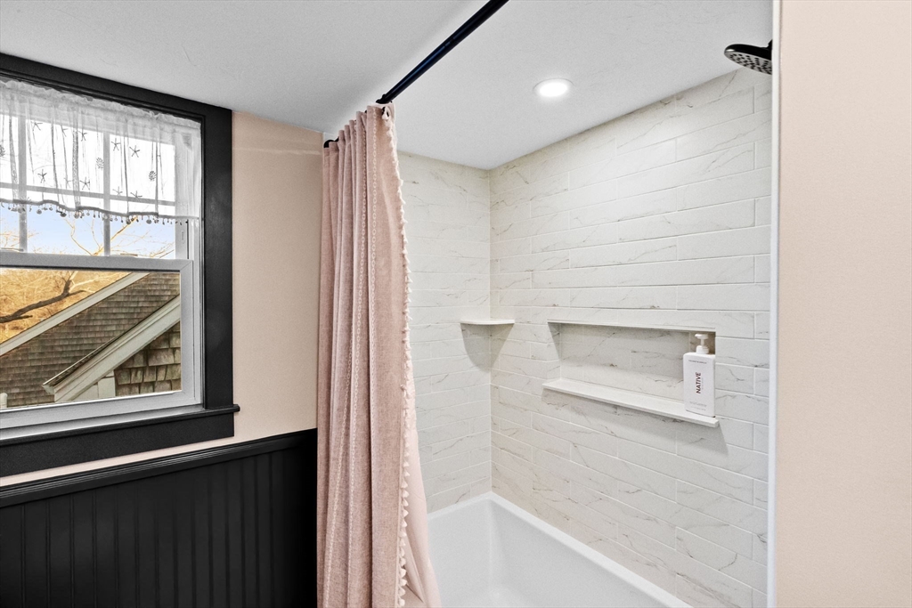 85 Summit Street Halifax, MA 02338 - Photo 24 of 42 a bathroom with a bathtub and a window