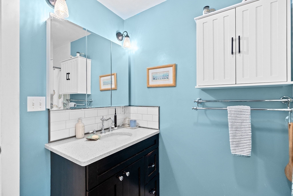 85 Summit Street Halifax, MA 02338 - Photo 30 of 42 a bathroom with a sink and a mirror