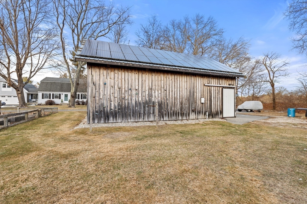 85 Summit Street Halifax, MA 02338 - Photo 33 of 42 a front view of residential houses with yard and road