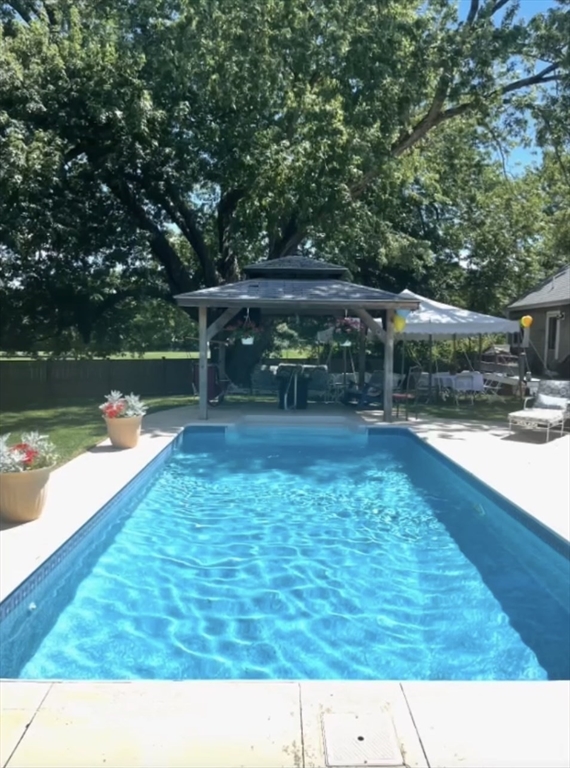 85 Summit Street Halifax, MA 02338 - Photo 37 of 42 a view of a swimming pool with a patio