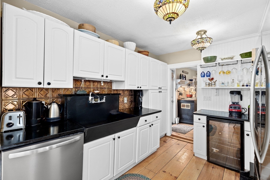 85 Summit Street Halifax, MA 02338 - Photo 7 of 42 a kitchen with stainless steel appliances granite countertop a refrigerator and a stove top oven