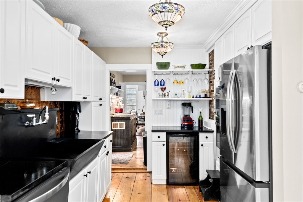 85 Summit Street Halifax, MA 02338 - Photo 8 of 42 a kitchen with stainless steel appliances a sink stove and refrigerator