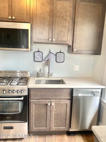 a kitchen with a stove and a sink