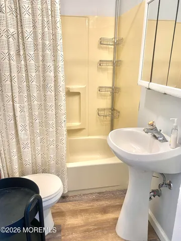 a bathroom with a sink toilet and tub
