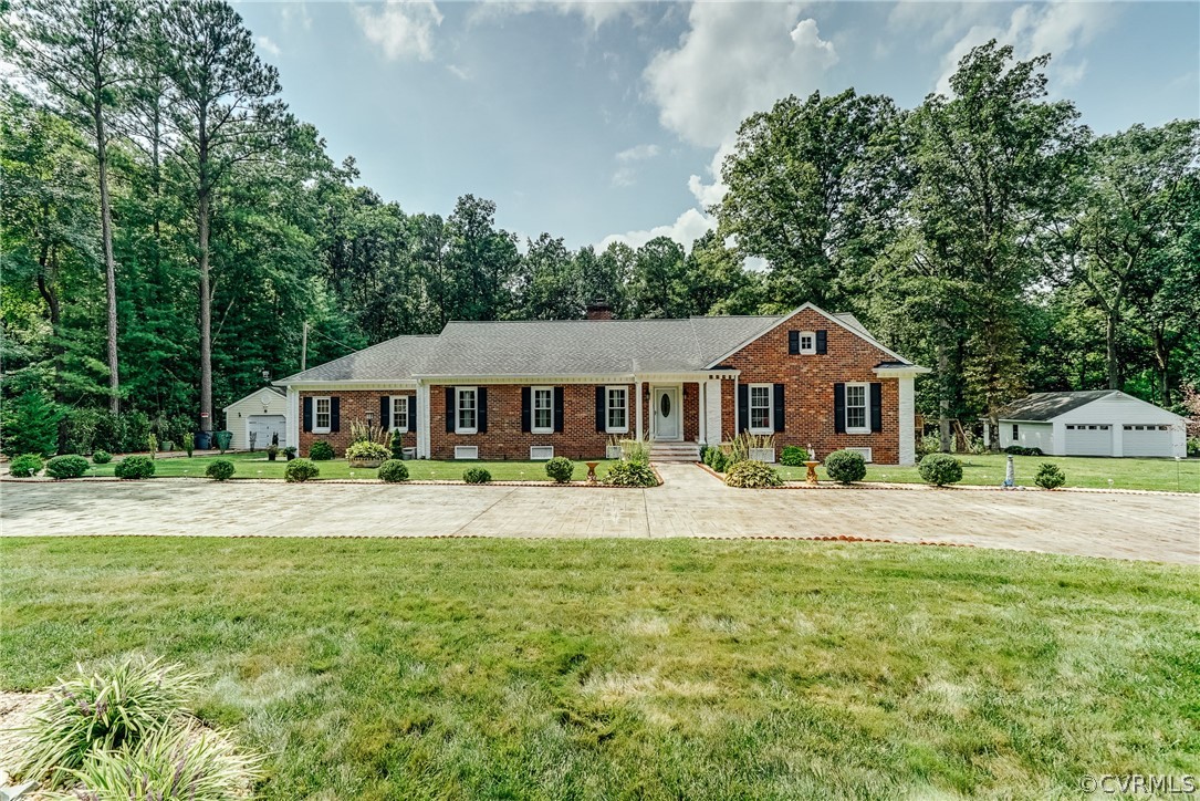 3918 Oxbridge Road North Chesterfield, VA 23236 - Photo 1 of 48 a front view of a house with garden