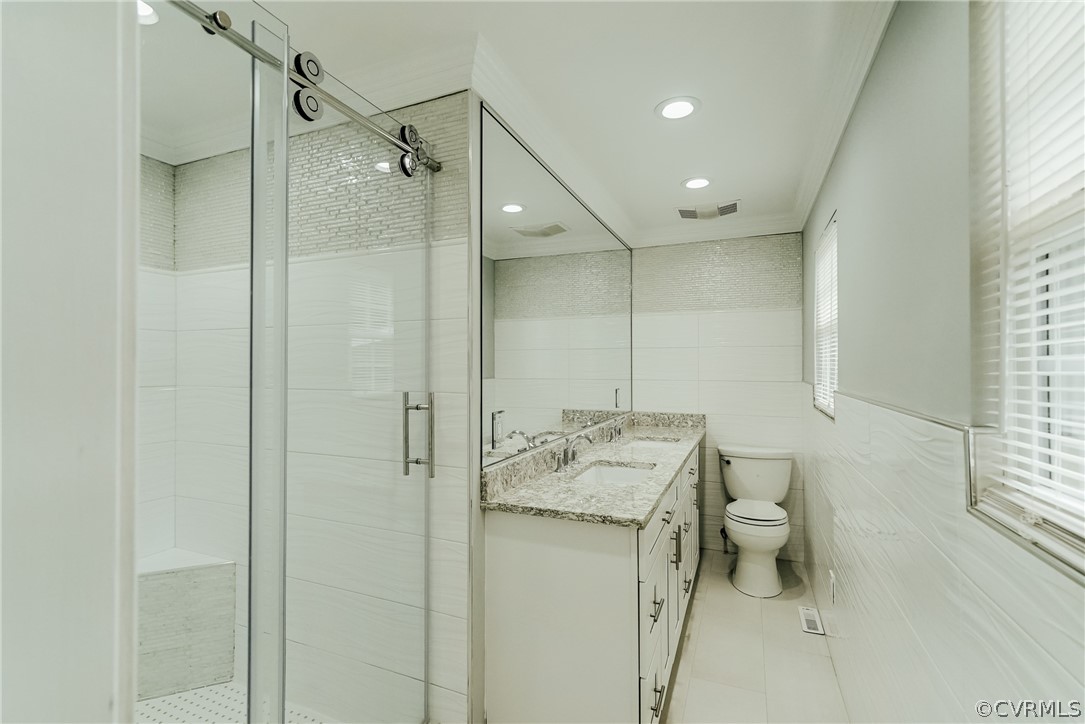 3918 Oxbridge Road North Chesterfield, VA 23236 - Photo 23 of 48 a bathroom with a granite countertop sink a toilet and shower
