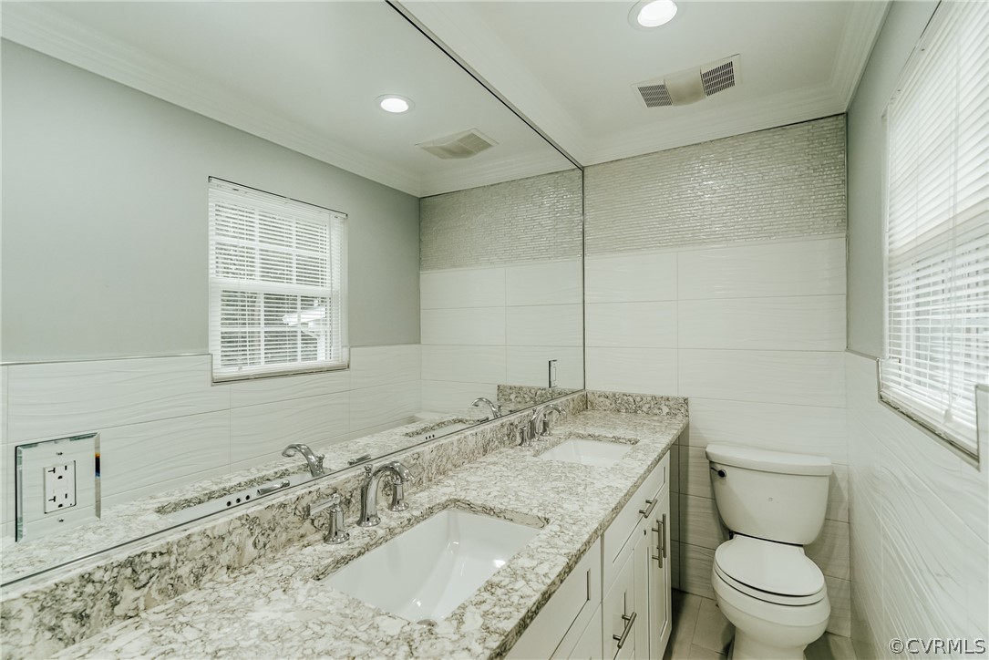 3918 Oxbridge Road North Chesterfield, VA 23236 - Photo 24 of 48 a bathroom with a granite countertop sink a toilet and a mirror