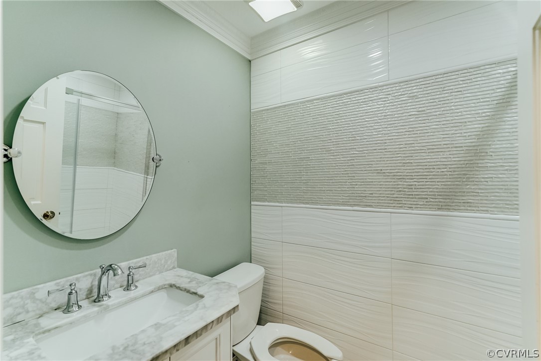 3918 Oxbridge Road North Chesterfield, VA 23236 - Photo 26 of 48 a bathroom with a granite countertop sink a mirror a toilet and a shower
