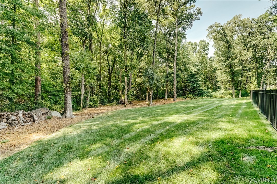 3918 Oxbridge Road North Chesterfield, VA 23236 - Photo 36 of 48 a backyard of a house with lots of green space