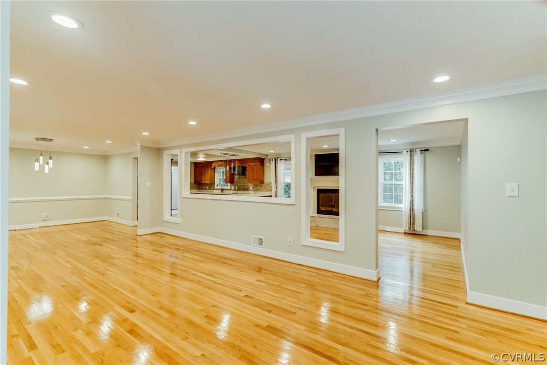 3918 Oxbridge Road North Chesterfield, VA 23236 - Photo 4 of 48 a view of an empty room with wooden floor and kitchen