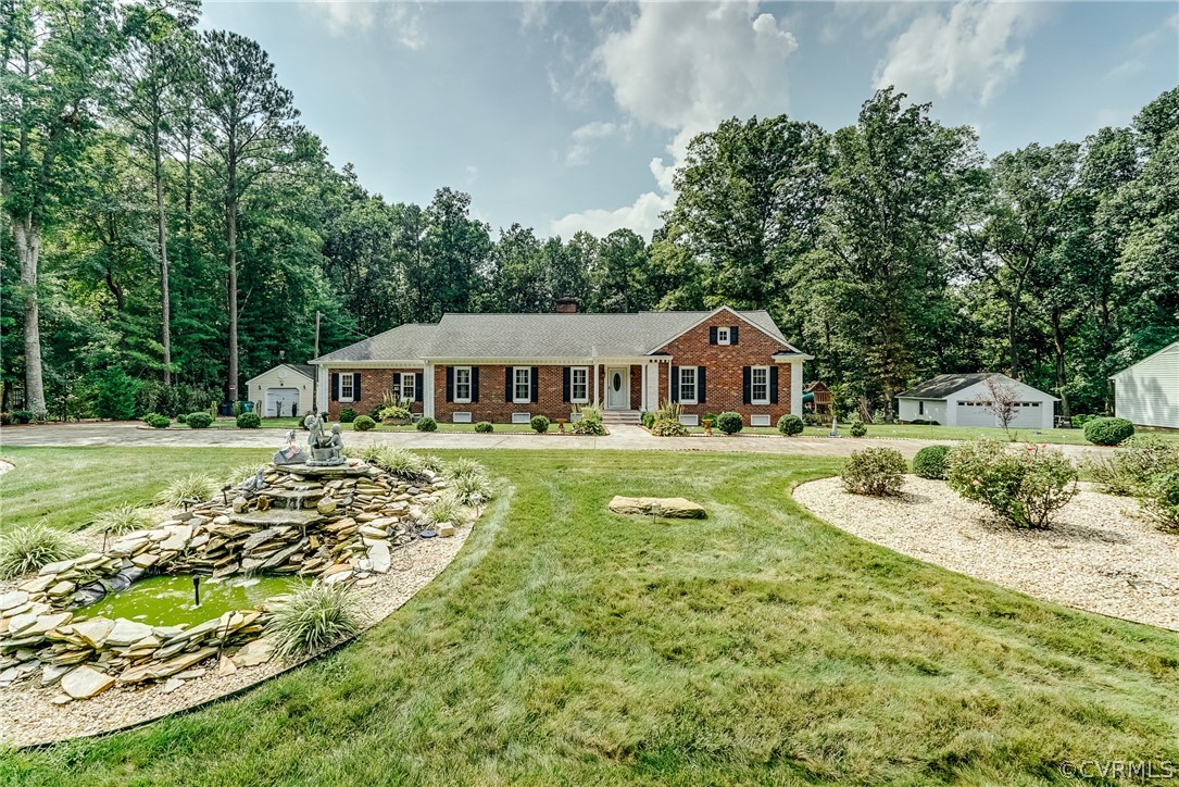3918 Oxbridge Road North Chesterfield, VA 23236 - Photo 47 of 48 a house with green field in front of it