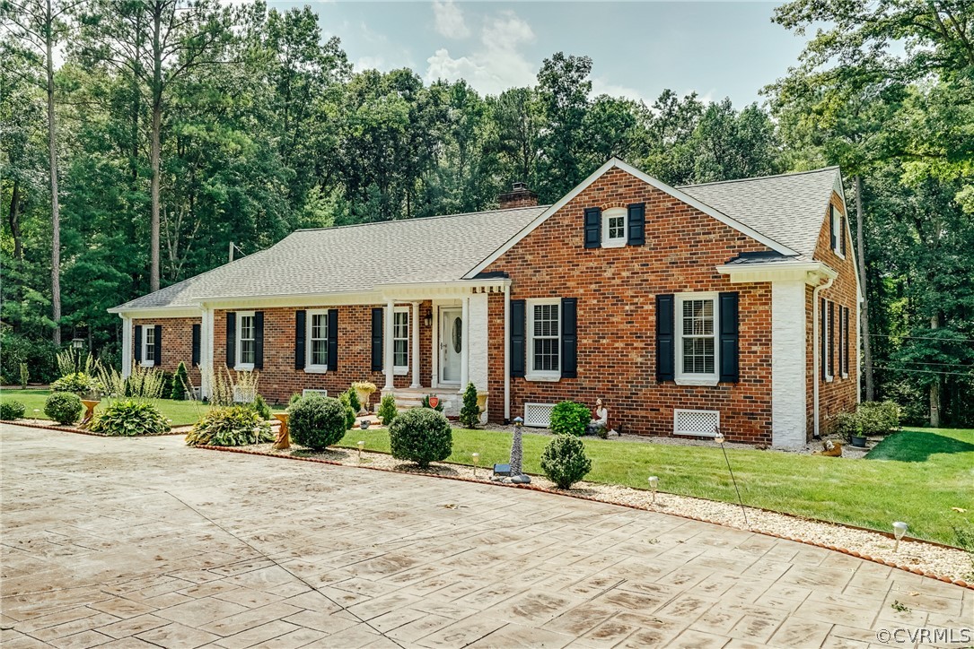 3918 Oxbridge Road North Chesterfield, VA 23236 - Photo 48 of 48 a front view of a house with a yard and potted plants