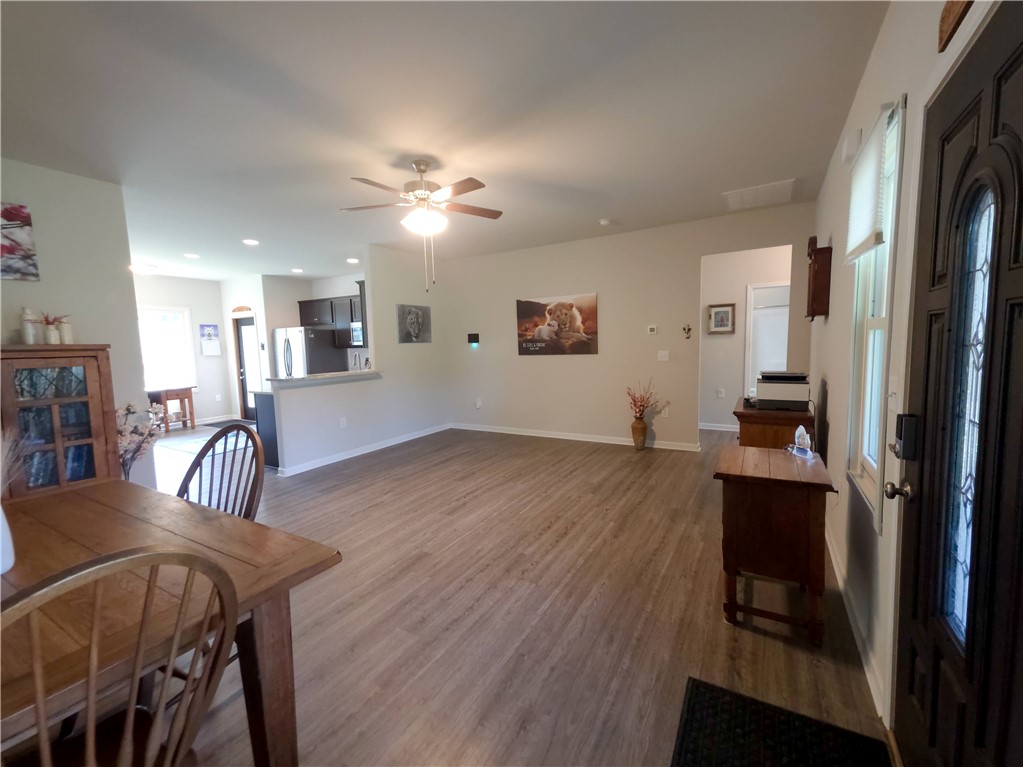 3 Cringle Lane Anderson, SC 29625 - Photo 3 of 26 An inviting open-concept living area with durable wood-look flooring flows into a modern kitchen.